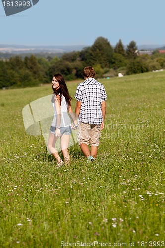 Image of young love couple smiling outdoor in summer 