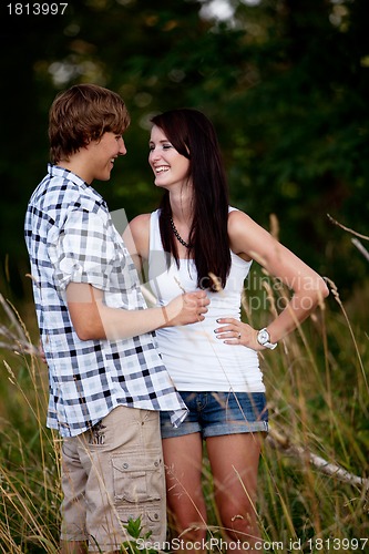 Image of young love couple smiling outdoor in summer 