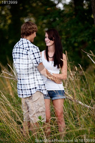 Image of young love couple smiling outdoor in summer 