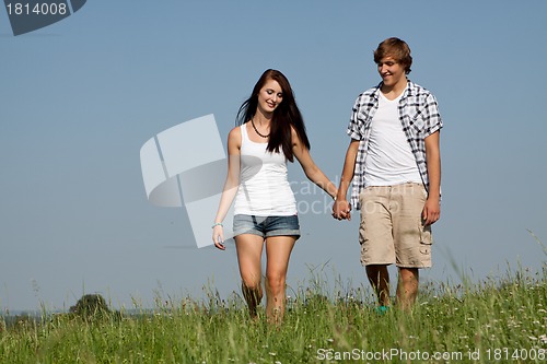 Image of young love couple smiling outdoor in summer 