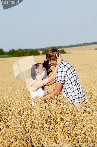 Image of happy couple in love outdoor in summer on field