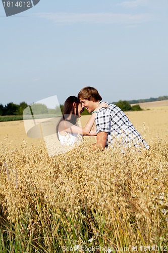 Image of happy couple in love outdoor in summer on field