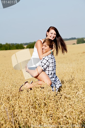 Image of happy couple in love outdoor in summer on field