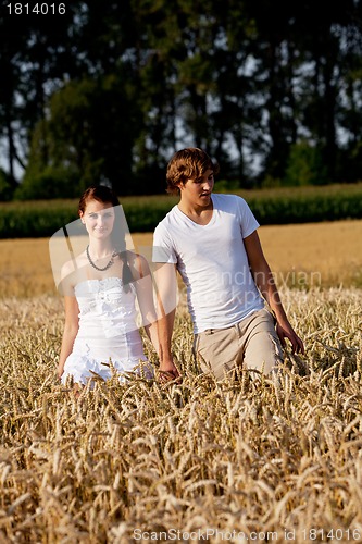 Image of happy couple in love outdoor in summer on field