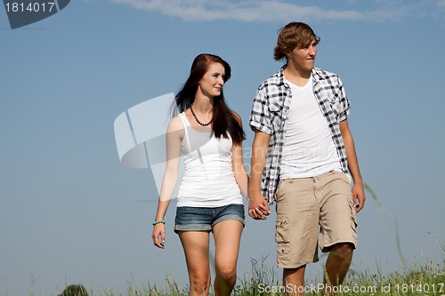 Image of young love couple smiling outdoor in summer 