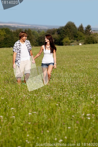 Image of young love couple smiling outdoor in summer 