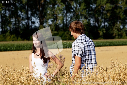 Image of happy couple in love outdoor in summer on field