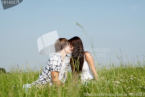 Image of young couple outdoor in summer on blanket in love