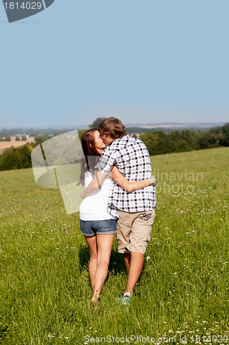 Image of young love couple smiling outdoor in summer 