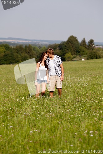 Image of young love couple smiling outdoor in summer 