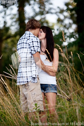 Image of young love couple smiling outdoor in summer 