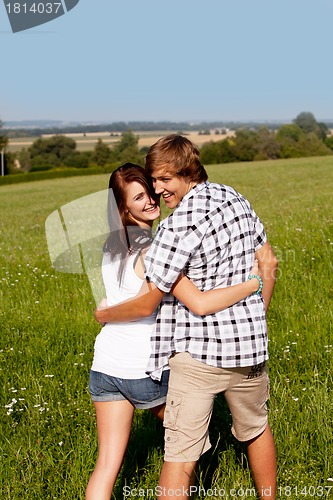 Image of young love couple smiling outdoor in summer 