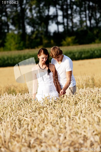 Image of happy couple in love outdoor in summer on field