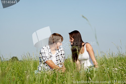 Image of young couple outdoor in summer on blanket in love