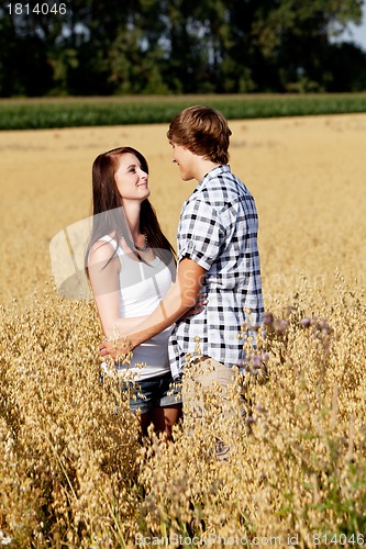 Image of happy couple in love outdoor in summer on field