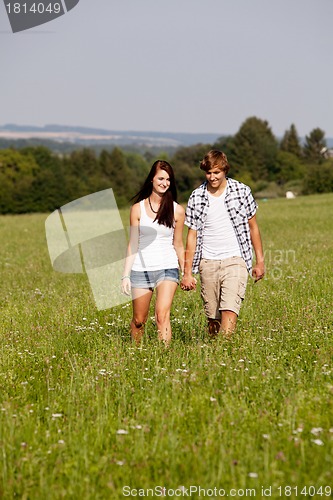 Image of young love couple smiling outdoor in summer 