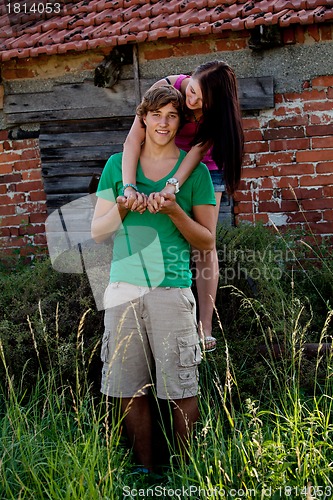 Image of young couple in love having fun in summer outdoor