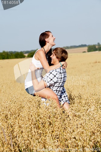 Image of happy couple in love outdoor in summer on field