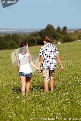Image of young love couple smiling outdoor in summer 