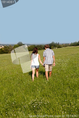 Image of young love couple smiling outdoor in summer 