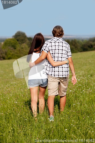 Image of young love couple smiling outdoor in summer 