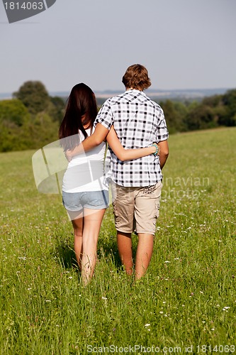 Image of young love couple smiling outdoor in summer 