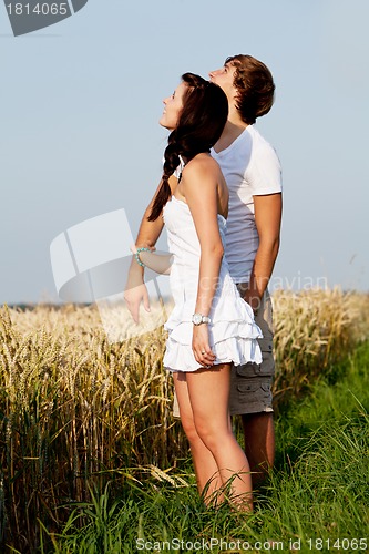 Image of happy couple in love outdoor in summer on field