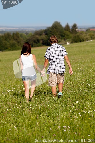 Image of young love couple smiling outdoor in summer 