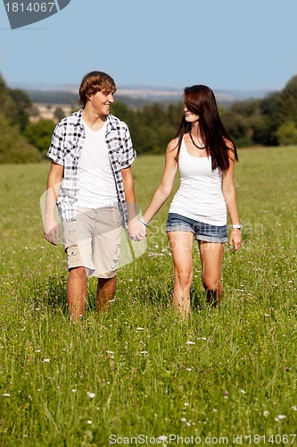 Image of young love couple smiling outdoor in summer 