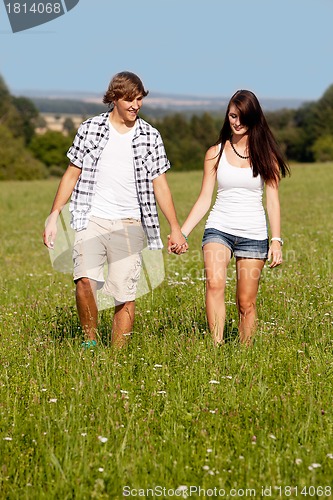 Image of young love couple smiling outdoor in summer 