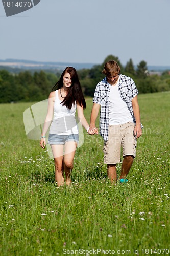 Image of young love couple smiling outdoor in summer 