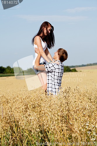 Image of happy couple in love outdoor in summer on field
