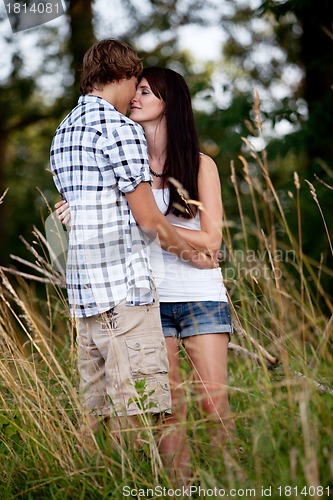 Image of young love couple smiling outdoor in summer 