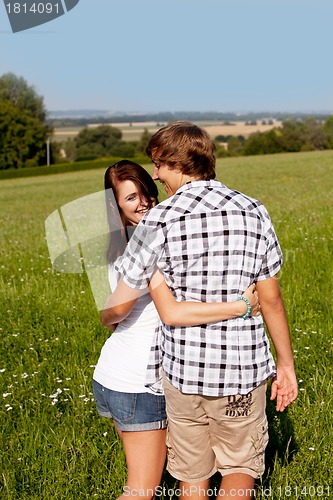 Image of young love couple smiling outdoor in summer 