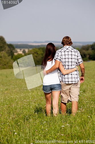 Image of young love couple smiling outdoor in summer 