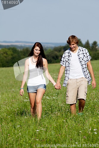 Image of young love couple smiling outdoor in summer 