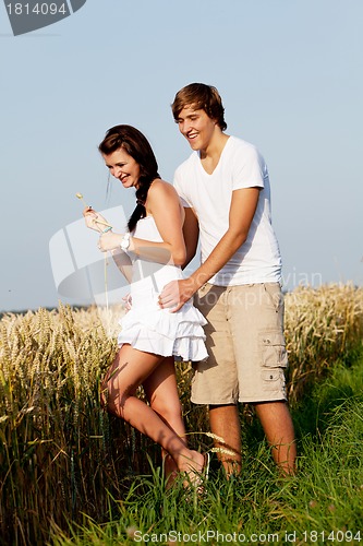 Image of happy couple in love outdoor in summer on field