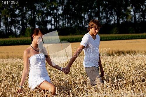 Image of happy couple in love outdoor in summer on field
