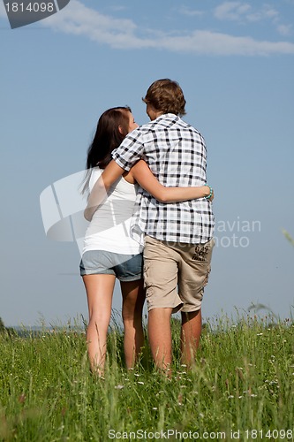 Image of young love couple smiling outdoor in summer 