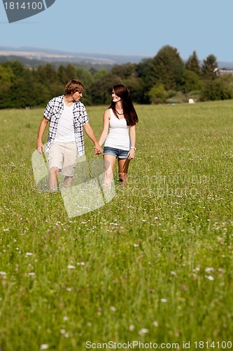 Image of young love couple smiling outdoor in summer 