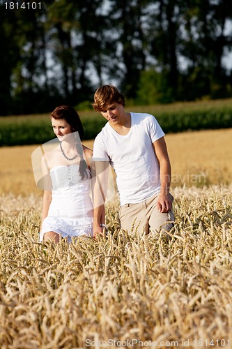 Image of happy couple in love outdoor in summer on field