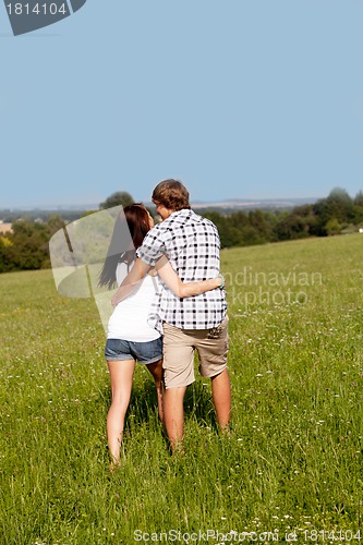 Image of young love couple smiling outdoor in summer 