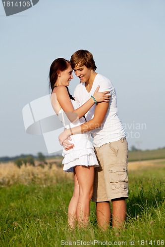 Image of young love couple smiling outdoor in summer 