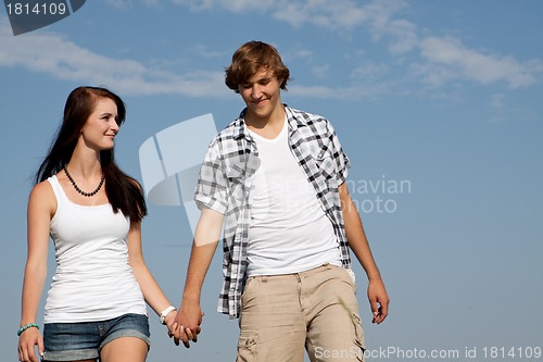 Image of young love couple smiling outdoor in summer 