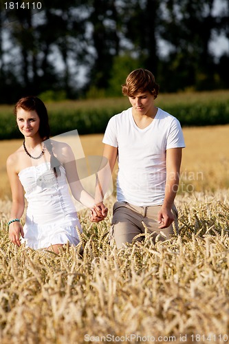 Image of happy couple in love outdoor in summer on field