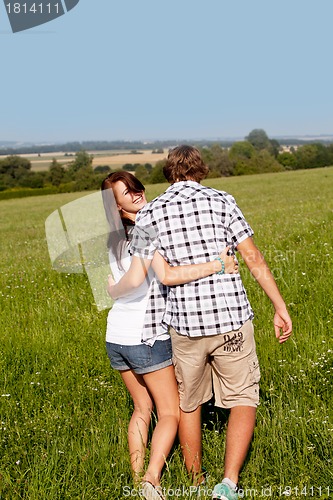Image of young love couple smiling outdoor in summer 