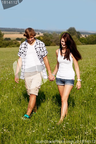 Image of young love couple smiling outdoor in summer 