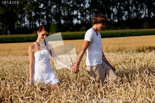 Image of happy couple in love outdoor in summer on field