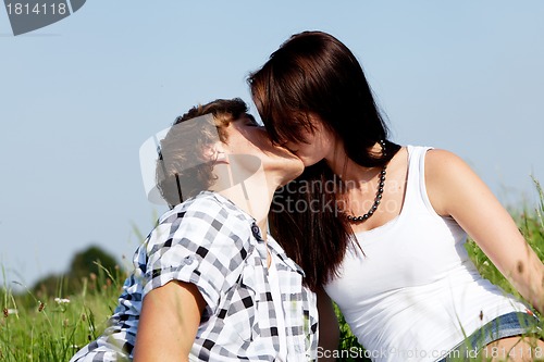 Image of young couple outdoor in summer on blanket in love