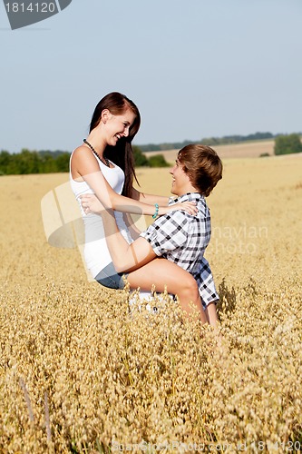Image of happy couple in love outdoor in summer on field